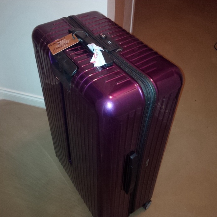 The suitcase before journey #1. Pretty and shiny. Not a scratch on it.