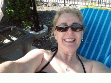 A selfie by the pool. 60 SPF sunscreen on and face covered up as to prevent wrinkles!